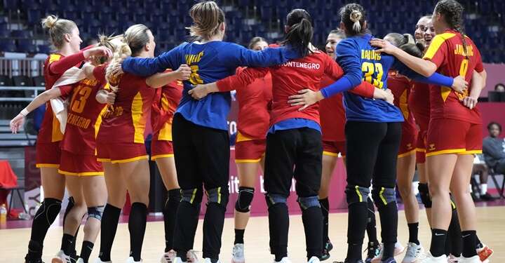 Montenegro players celebrate at the end of the women's preliminary round group A handball match between Montenegro and Angola at the 2020 Summer Olympics, Sunday, July 25, 2021, in Tokyo, Japan. (AP Photo/Sergei Grits)